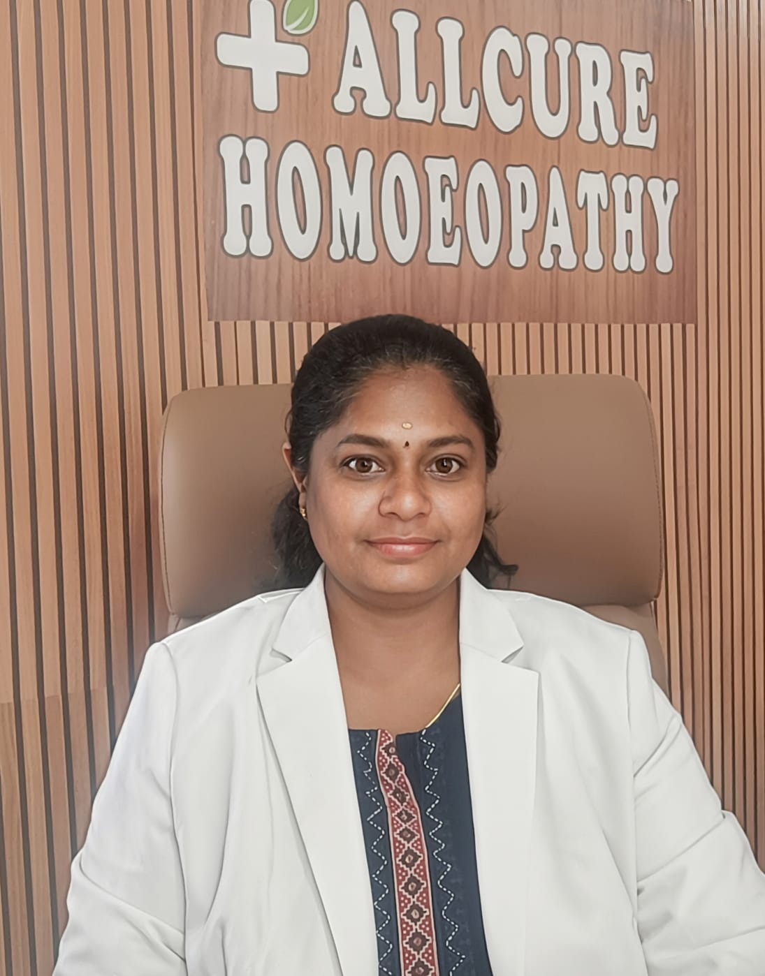 Allcure Homoeopathy doctor at the clinic in a white coat, ready for consultation